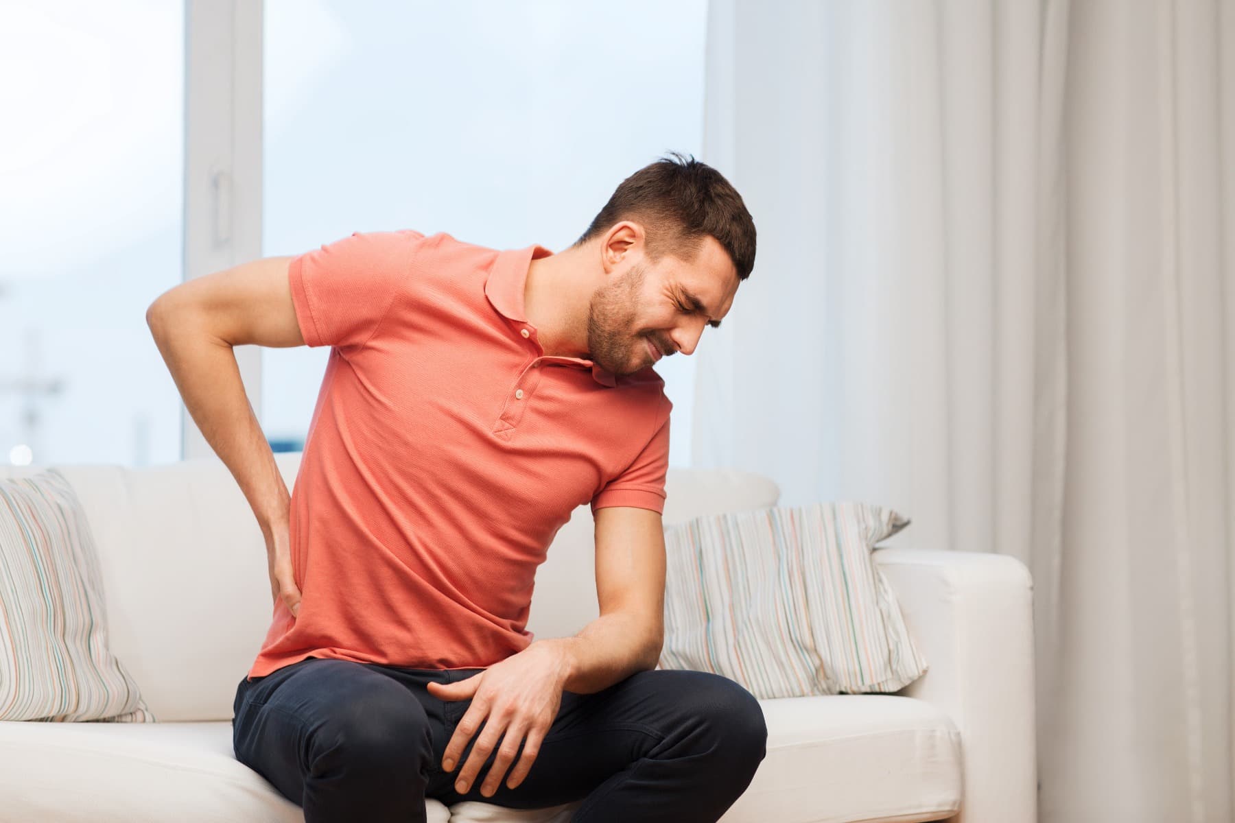 Man holding his back